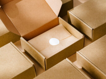 Brown cardboard boxes arranged neatly on a workspace, showcasing packaging materials for shipping and storage activities